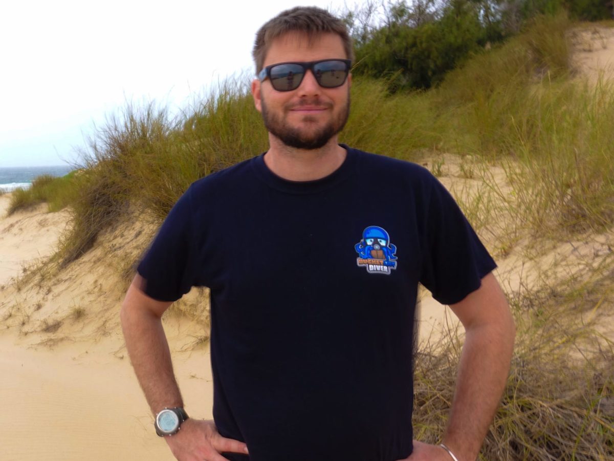 Antoni a man standing on a beach